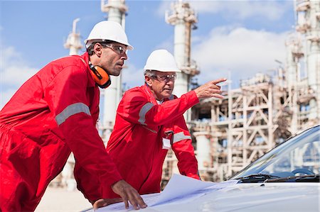 refinery - Workers with blueprints at oil refinery Stock Photo - Premium Royalty-Free, Code: 649-06040455