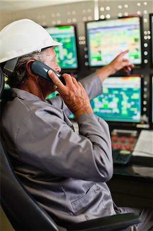 simsearch:649-07239830,k - Man working in security control room Stock Photo - Premium Royalty-Free, Code: 649-06040507