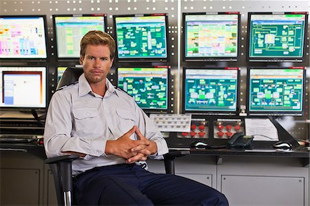Man working in security control room Stock Photo - Premium Royalty-Free, Code: 649-06040500