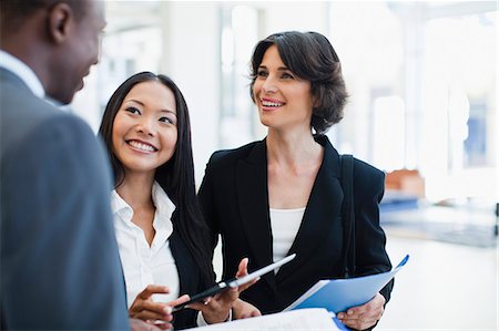simsearch:649-06040627,k - Business people talking in lobby Stock Photo - Premium Royalty-Free, Code: 649-06040628