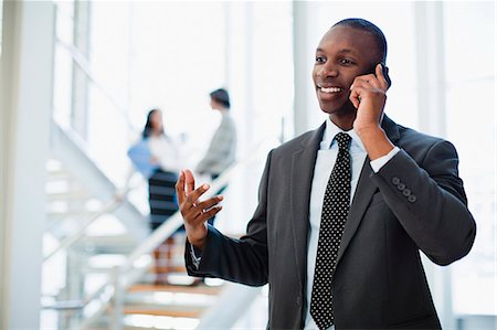 simsearch:649-06040639,k - Businessman on cell phone in office Stock Photo - Premium Royalty-Free, Code: 649-06040632