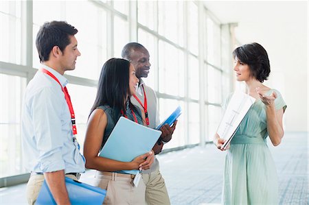 simsearch:649-06000952,k - Business people talking in lobby Stock Photo - Premium Royalty-Free, Code: 649-06040660