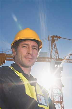 simsearch:649-06433219,k - Worker standing at construction site Stock Photo - Premium Royalty-Free, Code: 649-06040792