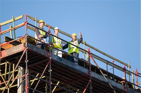 simsearch:649-06040720,k - Workers standing on scaffolding on site Stock Photo - Premium Royalty-Free, Code: 649-06040803