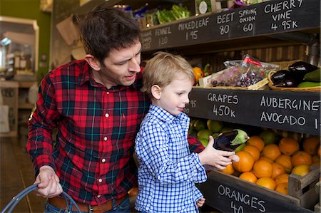 shelves at a grocery store - Father and son buying produce in store Stock Photo - Premium Royalty-Free, Code: 649-06041019