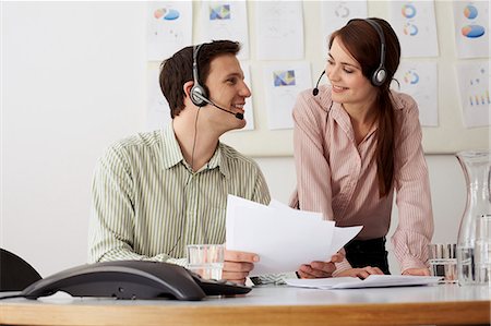 simsearch:649-06041170,k - Business people in headsets in office Stock Photo - Premium Royalty-Free, Code: 649-06041187