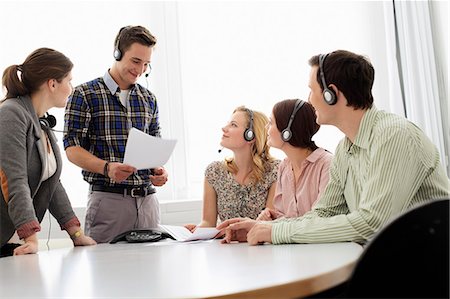 strategy table - Business people in headsets in meeting Stock Photo - Premium Royalty-Free, Code: 649-06041182