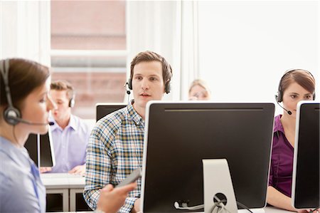 simsearch:649-06041170,k - Business people working in headsets Stock Photo - Premium Royalty-Free, Code: 649-06041219