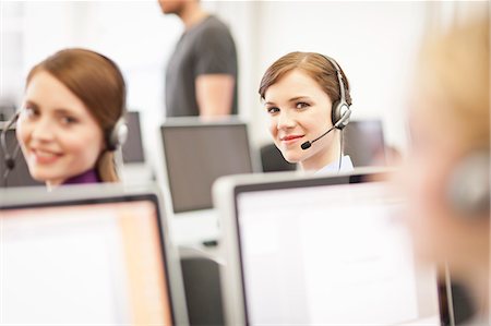 simsearch:6113-07243082,k - Businesswomen working in headsets Stock Photo - Premium Royalty-Free, Code: 649-06041229