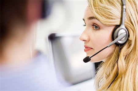 Business people working in headsets Stock Photo - Premium Royalty-Free, Code: 649-06041251