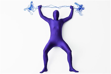 Man in bodysuit posing with string Stock Photo - Premium Royalty-Free, Code: 649-06041698