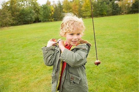 simsearch:649-06041783,k - Boy playing with chestnut on string Stock Photo - Premium Royalty-Free, Code: 649-06041804