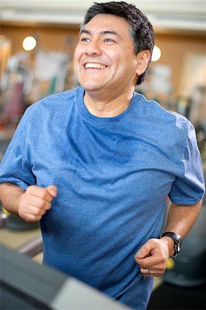 Man using treadmill in gym Stock Photo - Premium Royalty-Free, Code: 649-06042032