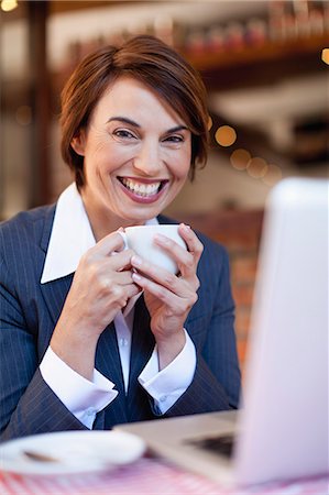 simsearch:649-05648787,k - Businesswoman using laptop in cafe Stock Photo - Premium Royalty-Free, Code: 649-06112757