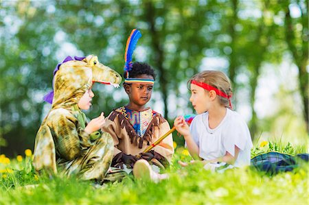 Boys playing dress up outdoors Stock Photo - Premium Royalty-Free, Code: 649-06112825