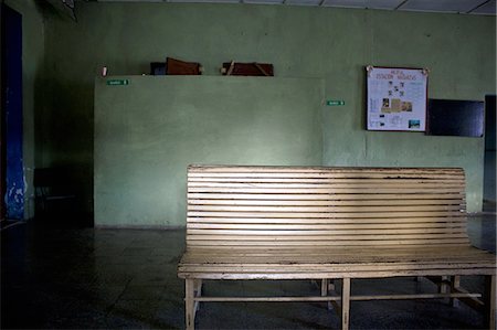 Wooden bench in waiting area Stock Photo - Premium Royalty-Free, Code: 649-06113231