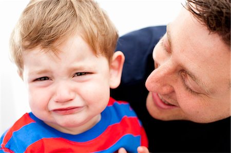 sad preschooler - Father comforting crying son Stock Photo - Premium Royalty-Free, Code: 649-06113422