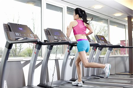 pony tail - Woman running on treadmill in gym Stock Photo - Premium Royalty-Free, Code: 649-06113438
