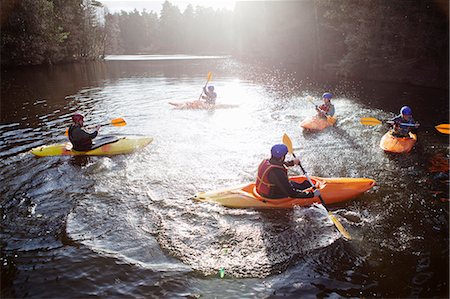 Kayakers rowing in still lake Stock Photo - Premium Royalty-Free, Code: 649-06113546