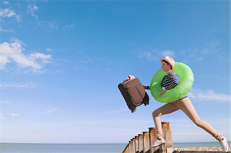 simsearch:614-00602699,k - Teenage girl with suitcase on dock Stock Photo - Premium Royalty-Free, Code: 649-06113746