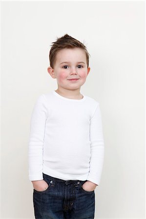 Smiling boy with hands in pockets Stock Photo - Premium Royalty-Free, Code: 649-06164429