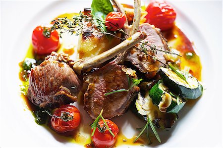 simsearch:649-06352937,k - Plate of lamb cutlets with tomatoes Stock Photo - Premium Royalty-Free, Code: 649-06165126
