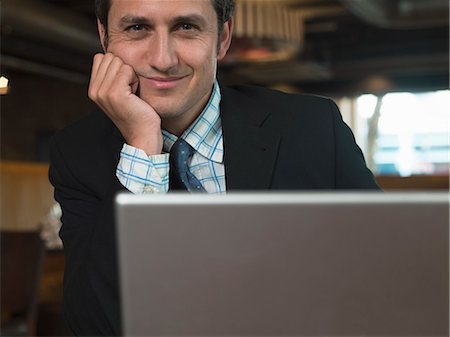 Businessman working on laptop in cafe Stock Photo - Premium Royalty-Free, Code: 649-06165261