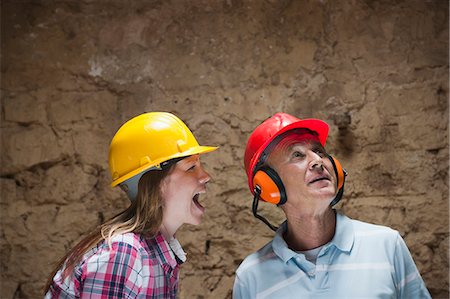 Construction worker yelling at colleague Stock Photo - Premium Royalty-Free, Code: 649-06304882