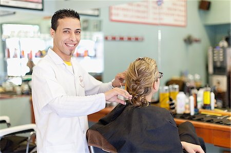 Barber working on client in shop Stock Photo - Premium Royalty-Free, Code: 649-06305055