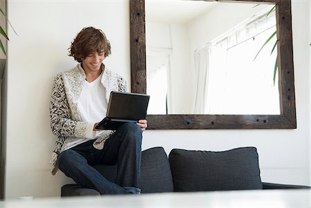 simsearch:649-05648787,k - Teenage boy using laptop on sofa Stock Photo - Premium Royalty-Free, Code: 649-06305214