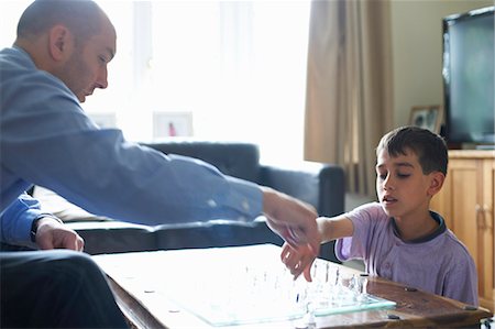 simsearch:649-06716505,k - Father and son playing chess together Stock Photo - Premium Royalty-Free, Code: 649-06305736