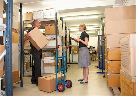 dolly - Workers talking in warehouse Stock Photo - Premium Royalty-Free, Code: 649-06305910