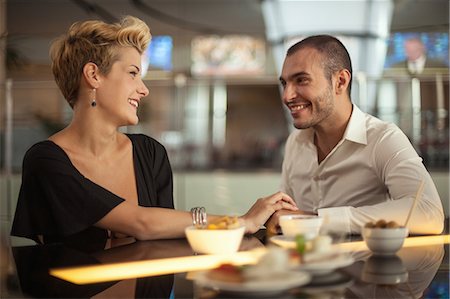 eating at restaurant - Smiling couple relaxing at bar Stock Photo - Premium Royalty-Free, Code: 649-06352511