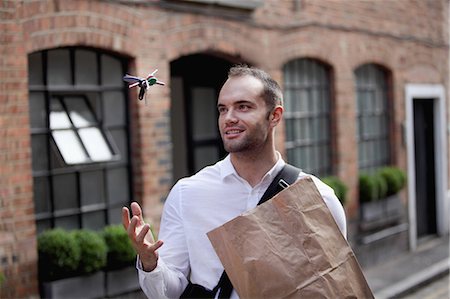 energy consumption - Businessman tossing keys in air Stock Photo - Premium Royalty-Free, Code: 649-06352718