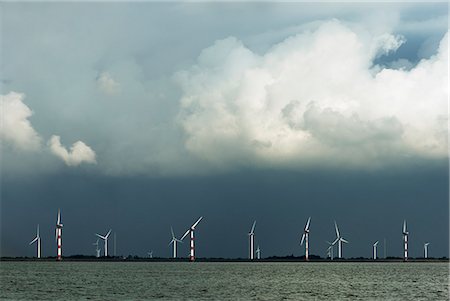 environmental issues and alternative energy - Wind turbines on coastline Stock Photo - Premium Royalty-Free, Code: 649-06353012