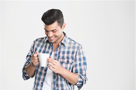 person isolated shirt - Man having cup of coffee Stock Photo - Premium Royalty-Free, Code: 649-06353174