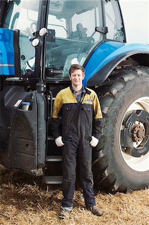 farm workers - Farmer standing by tractor in field Stock Photo - Premium Royalty-Free, Code: 649-06353318