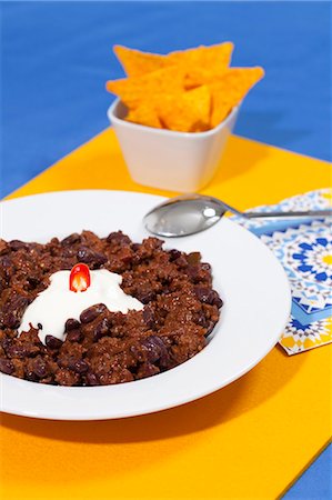 simsearch:6115-07282767,k - Plate of chili con carne with sour cream Stock Photo - Premium Royalty-Free, Code: 649-06400764