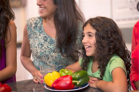 simsearch:649-06401393,k - Smiling girl with family in kitchen Stock Photo - Premium Royalty-Free, Code: 649-06401421