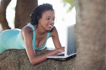 simsearch:649-05648787,k - Woman using laptop on a tree branch Stock Photo - Premium Royalty-Free, Code: 649-06432360