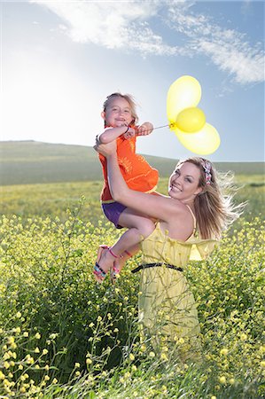 environment  family - Sisters playing in field of flowers Stock Photo - Premium Royalty-Free, Code: 649-06432415