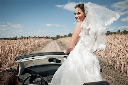 drive scenery - Newlywed couple driving in convertible Stock Photo - Premium Royalty-Free, Code: 649-06432547