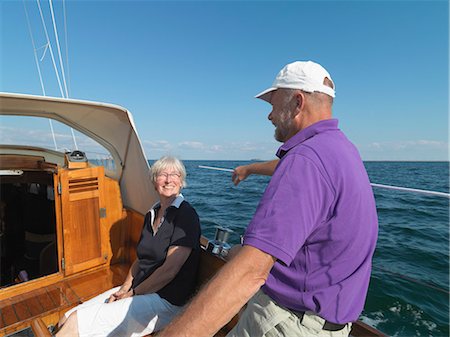 simsearch:649-05520995,k - Older couple sailing together on ocean Stock Photo - Premium Royalty-Free, Code: 649-06432701
