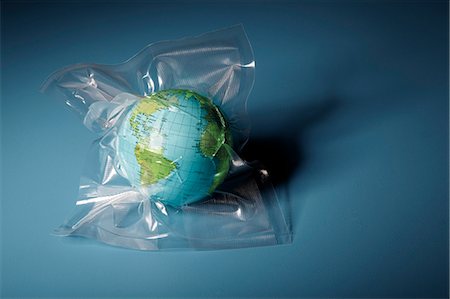Globe shrink wrapped in plastic Stock Photo - Premium Royalty-Free, Code: 649-06432773