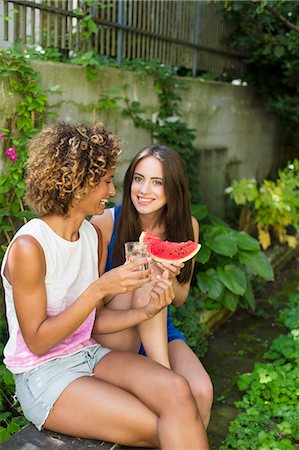 Smiling women eating watermelon Stock Photo - Premium Royalty-Free, Code: 649-06432892