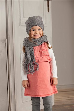 Smiling girl wearing hat and scarf Stock Photo - Premium Royalty-Free, Code: 649-06433315