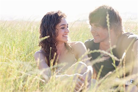 Couple relaxing in tall grass Stock Photo - Premium Royalty-Free, Code: 649-06488568