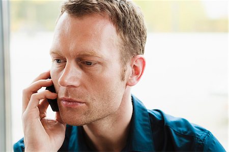 simsearch:649-06041170,k - Businessman talking on cell phone Stock Photo - Premium Royalty-Free, Code: 649-06488877