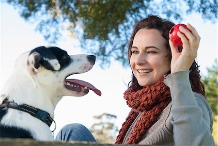 dogs in nature - Woman playing fetch with dog Stock Photo - Premium Royalty-Free, Code: 649-06489054