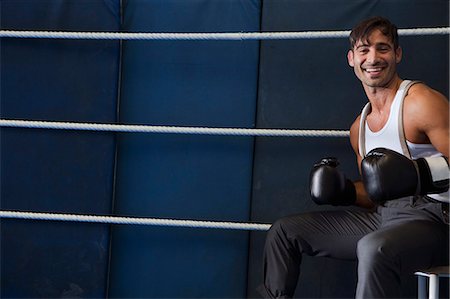 simsearch:649-06041783,k - Smiling boxer sitting in ring Stock Photo - Premium Royalty-Free, Code: 649-06489209